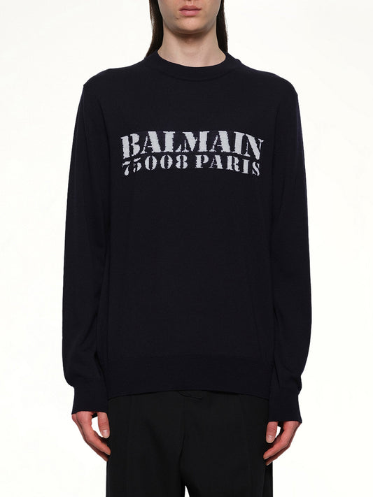 Image of a model wearing Outerwear. Product name - Balmain Big Stamp Knit Sweater in Navy colour by brand - BALMAIN
