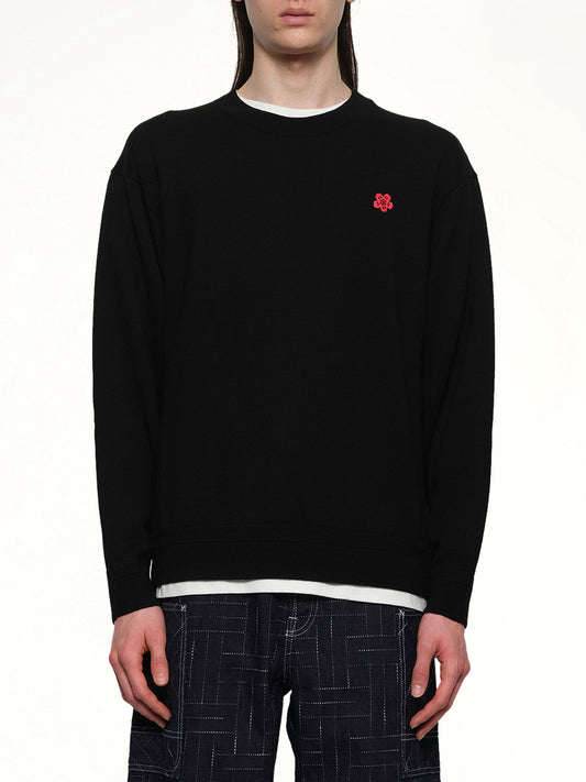 Image of a model wearing Outerwear. Productname: Rws Kenzo Boke Flower Jumper in Black colour by brand - KENZO