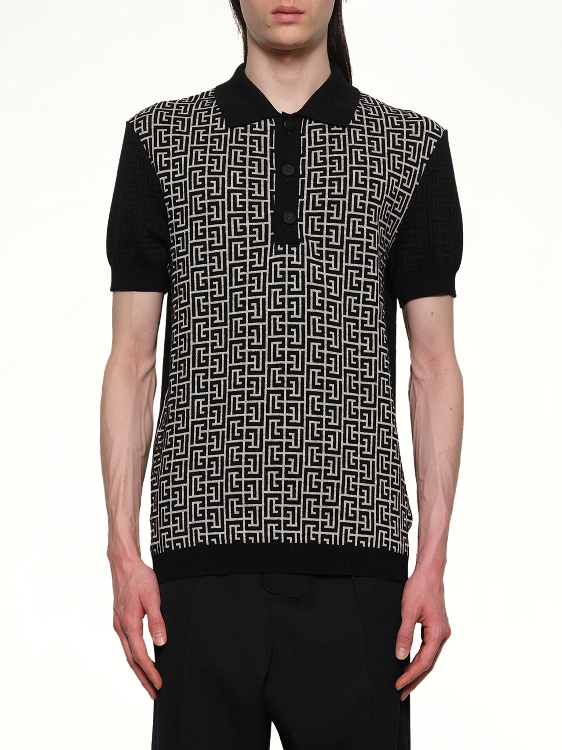 Image of a model wearing Tops. Productname: BALMAIN Mix Monogram Knit Polo in Ivory/Black colour by brand - BALMAIN