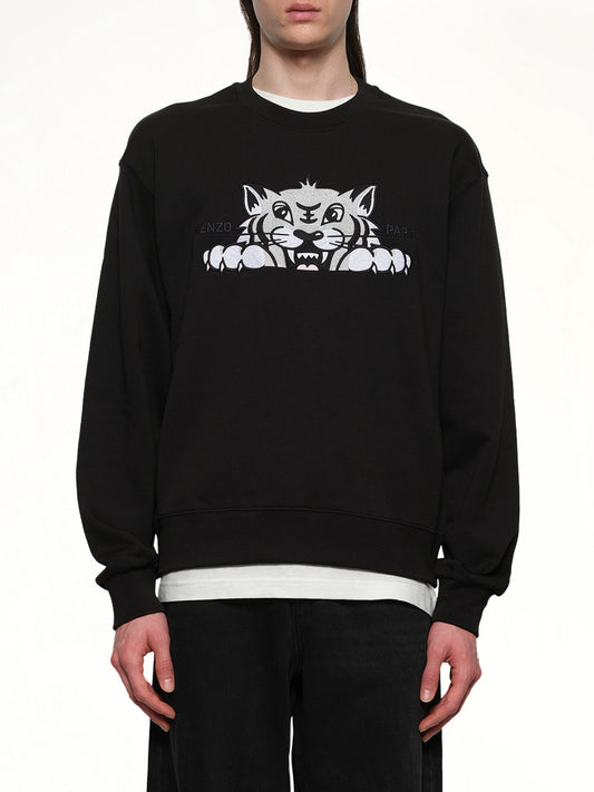 Image of a model wearing Outerwear. Productname: KENZO Kenzo Happy Tiger Embroidered Classic Sweatshirt in Black colour by brand - KENZO