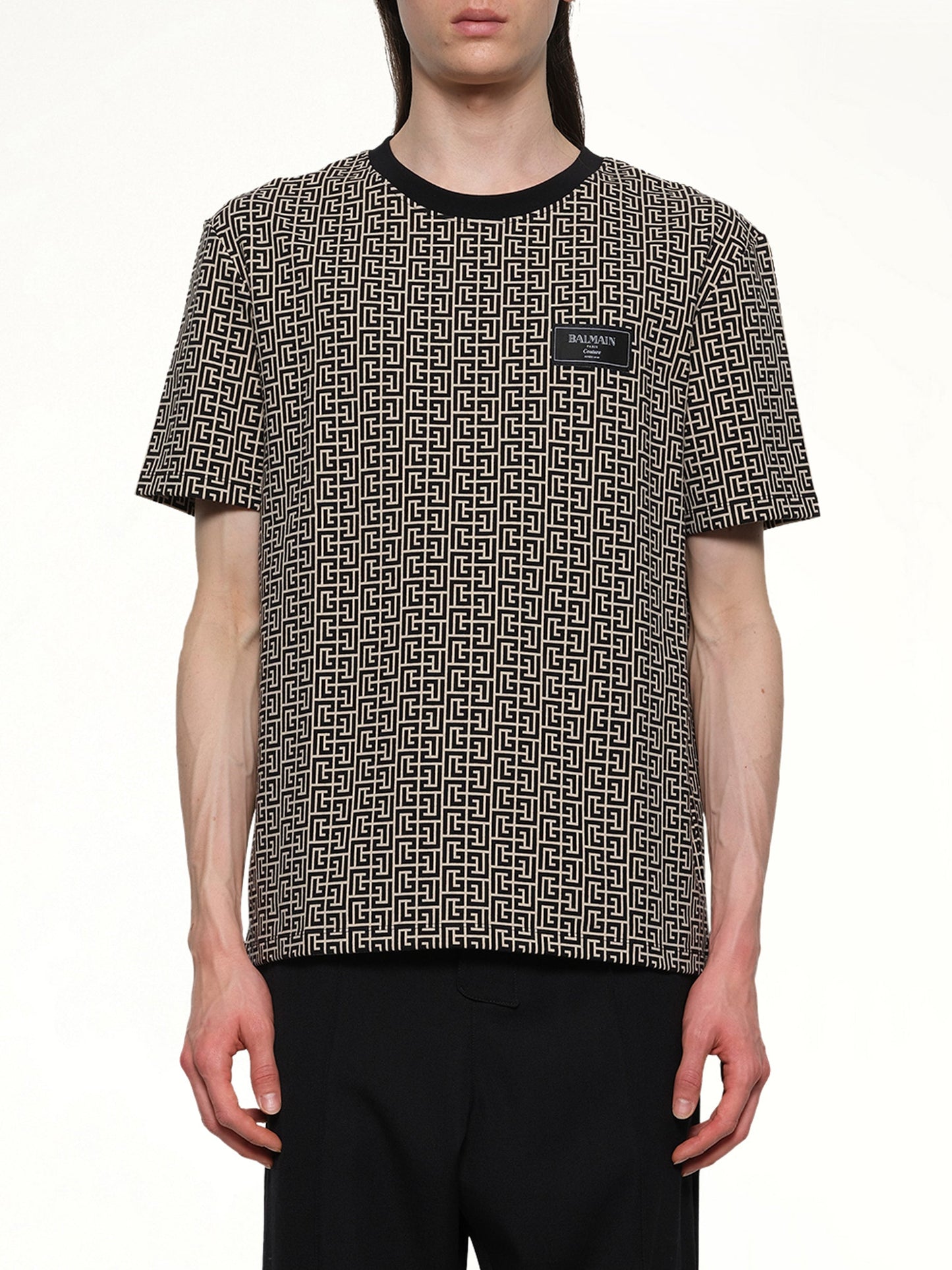 Image of a model wearing Tops. Productname: BALMAIN Monogram Couture Label Regular T-Shirt in IVORY/BLACK colour by brand - BALMAIN