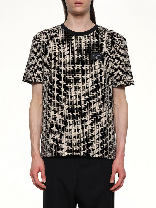 Image of a model wearing Tops. Productname: BALMAIN Monogram Couture Label Regular T-Shirt in IVORY/BLACK colour by brand - BALMAIN