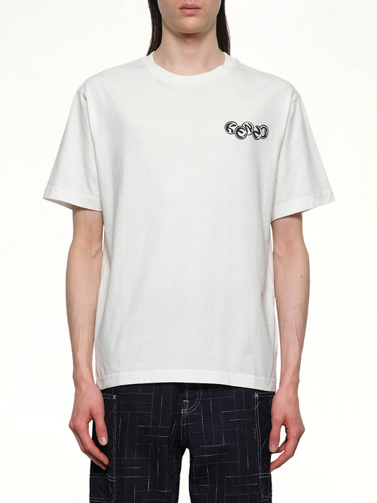 Image of a model wearing Tops. Productname: KENZO Gots Kenzo Pachinko Classic T-Shirt in OFF WHITE colour by brand - KENZO