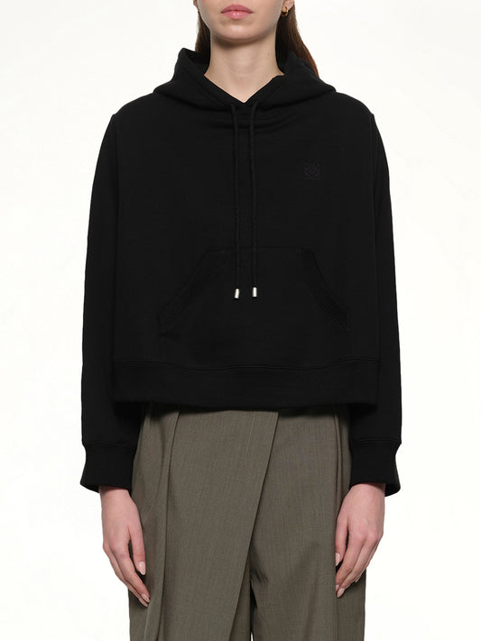 Image of a model wearing Outerwear. Productname: LOEWE Trapeze Hoodie in Black colour by brand - LOEWE