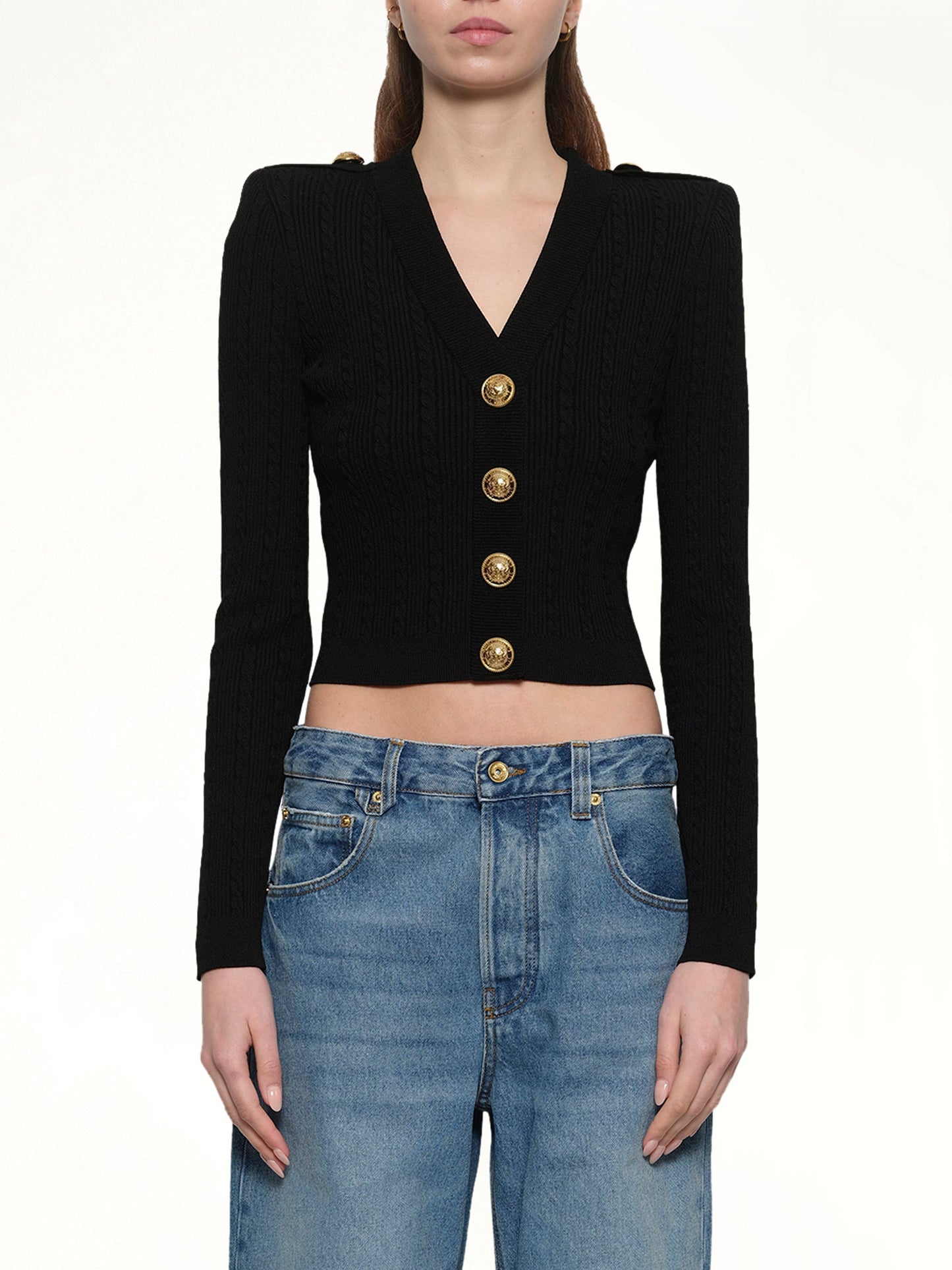 Image of a model wearing Outerwear. Productname: BALMAIN LS Buttoned V-Neck Torsade Knit Cardigan in Black colour by brand - BALMAIN