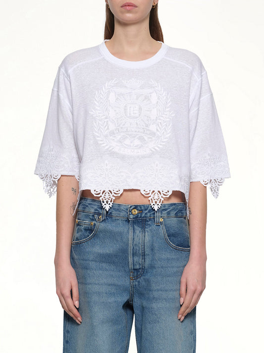 Image of a model wearing Tops. Productname: BALMAIN Balmain Emblem Baseball T-Shirt in WHITE colour by brand - BALMAIN