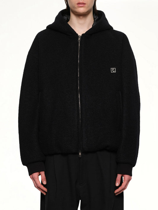 Image of a model wearing Outerwear. Productname: WOOYOUNGMI Padded Hoodie in BLACK colour by brand - WOOYOUNGMI