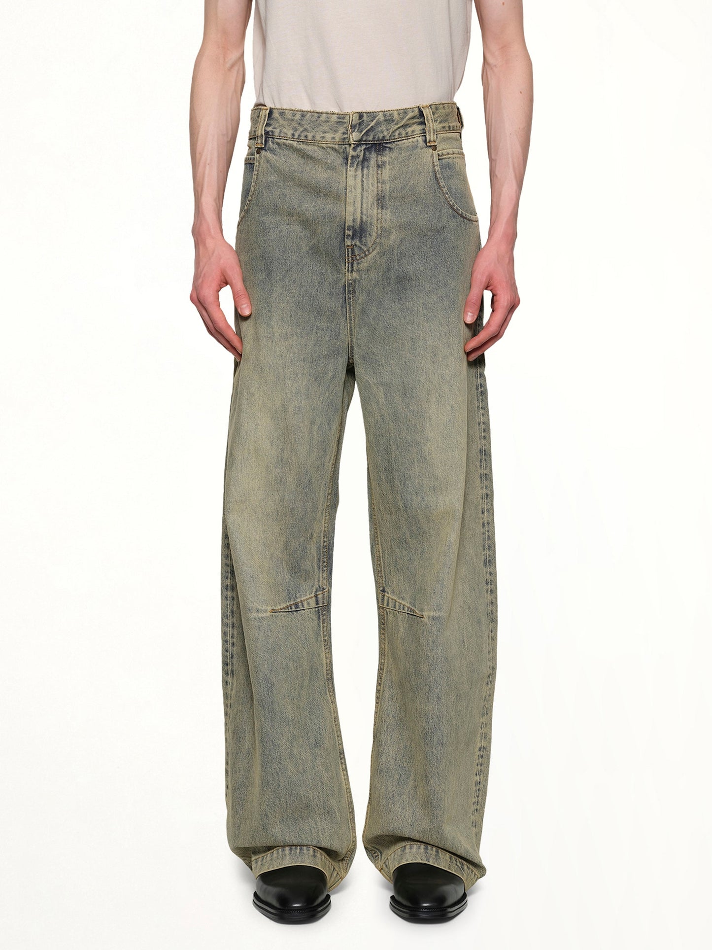 Image of a model wearing Denim. Productname: ENTIRE STUDIOS Gem Jeans in SURFACEWAVE colour by brand - ENTIRE STUDIOS