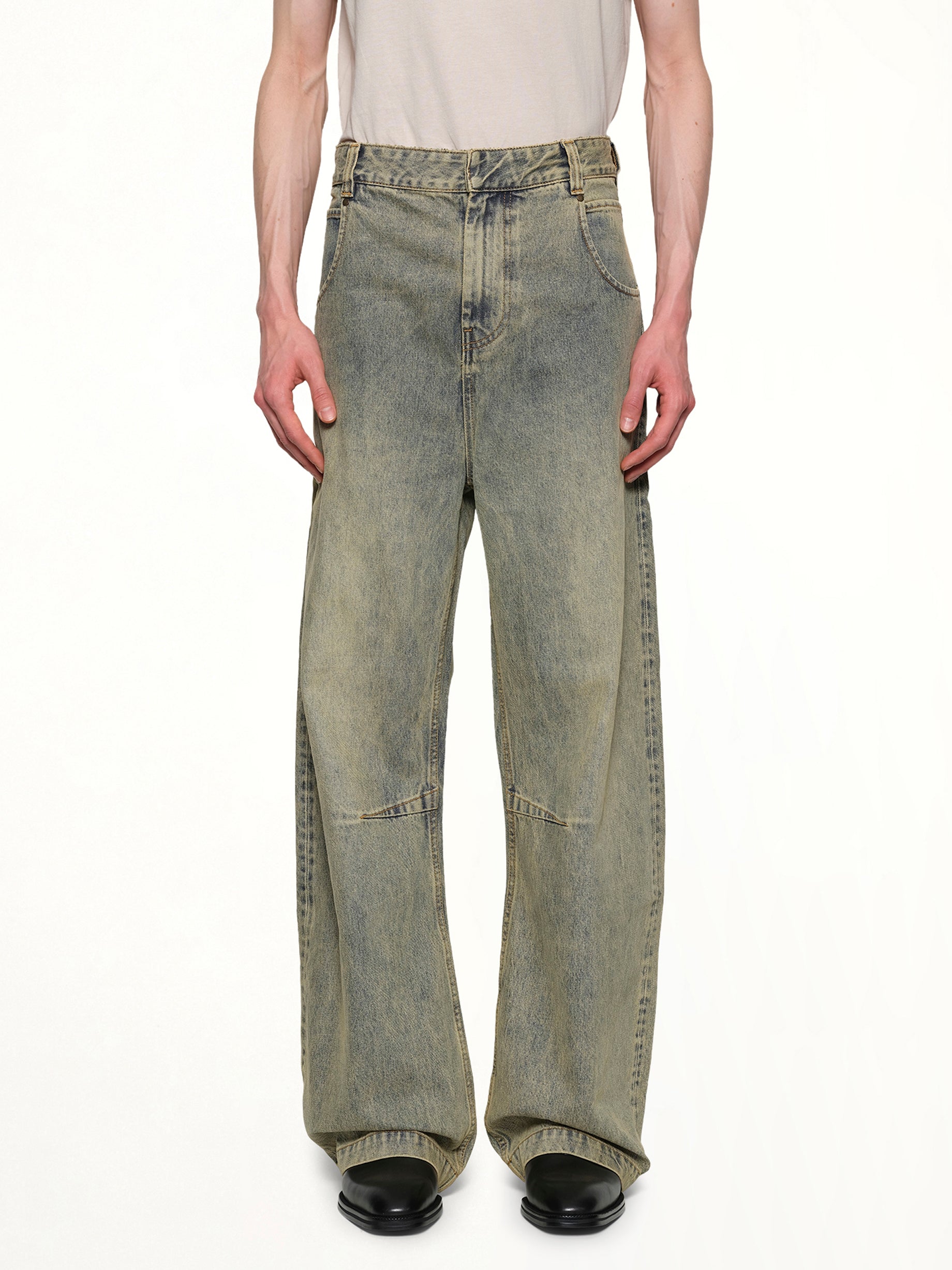 Image of a model wearing Denim. Productname: ENTIRE STUDIOS Gem Jeans in SURFACEWAVE colour by brand - ENTIRE STUDIOS