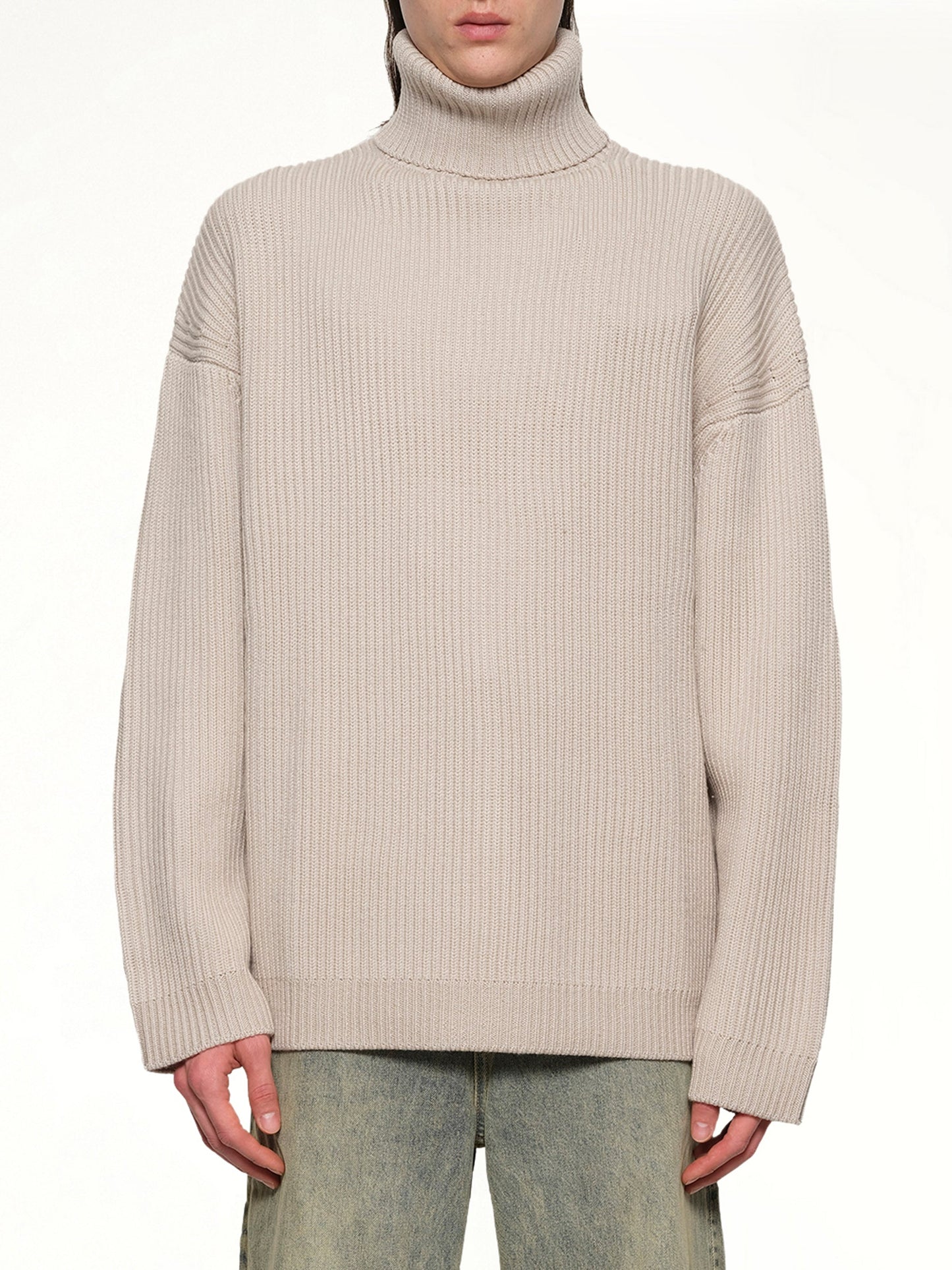Image of a model wearing Outerwear. Productname: ENTIRE STUDIOS Chunky Turtleneck in BEIGE colour by brand - ENTIRE STUDIOS