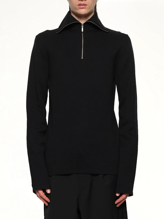 Image of a model wearing Outerwear. Product name - Zip Up Turtle Neck in Black colour by brand - ENTIRE STUDIOS