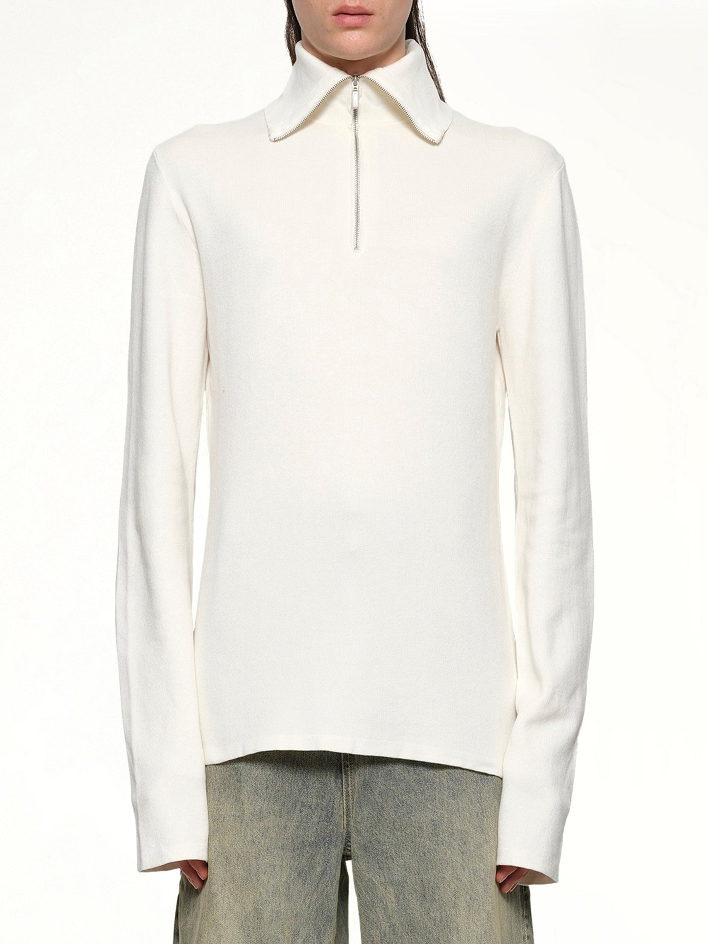 Image of a model wearing Outerwear. Productname: ENTIRE STUDIOS Zip Up Turtle Neck in IVORY colour by brand - ENTIRE STUDIOS
