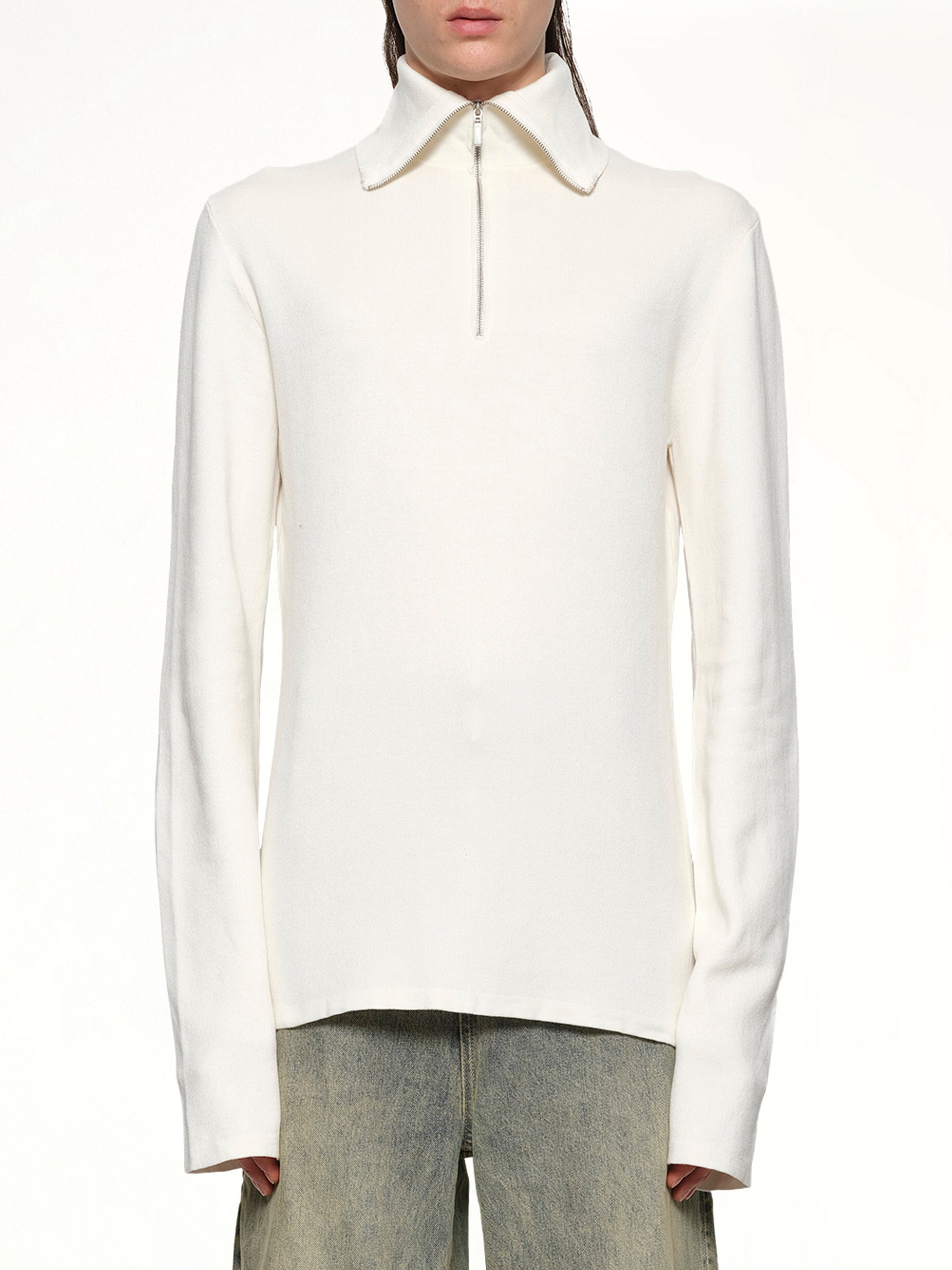 Image of a model wearing Outerwear. Productname: ENTIRE STUDIOS Zip Up Turtle Neck in IVORY colour by brand - ENTIRE STUDIOS