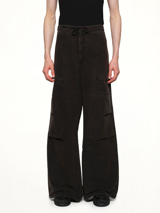 Image of a model wearing Pants. Product name - Barren Cargo in Black colour by brand - ENTIRE STUDIOS