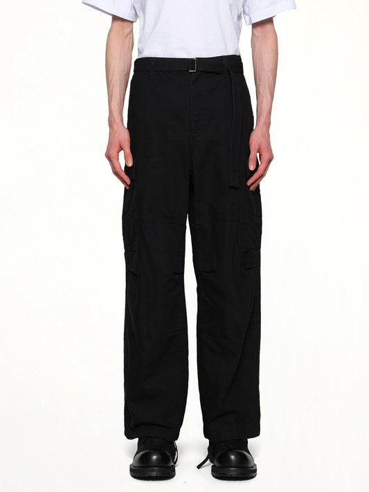 Image of a model wearing Pants. Productname: SACAI Carhartt WIP Duck Pants in Black colour by brand - SACAI