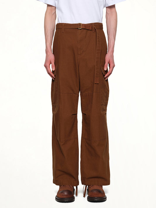 Image of a model wearing Pants. Productname: SACAI Carhartt WIP Duck Pants in Dark Beige colour by brand - SACAI