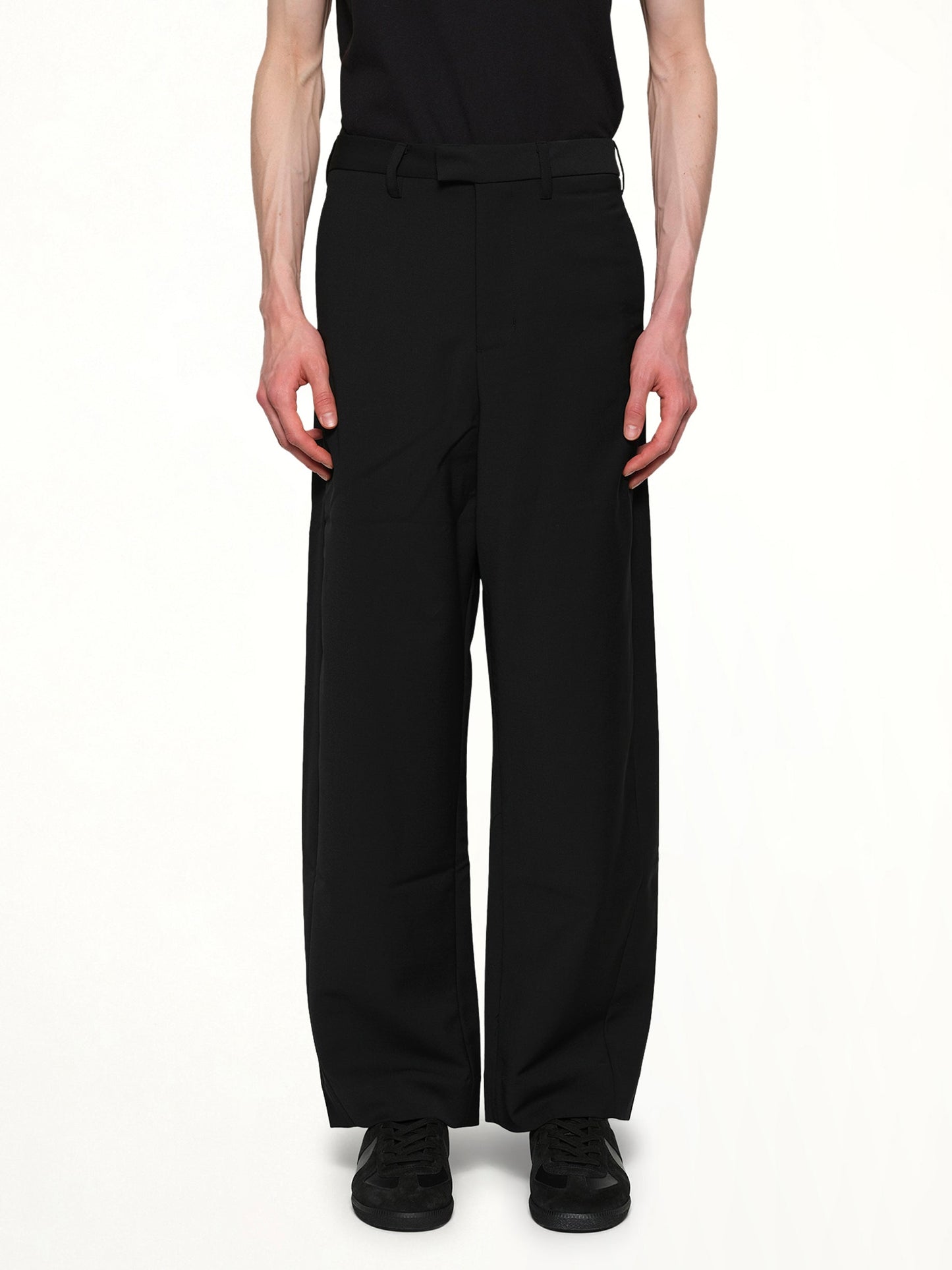 Image of a model wearing Pants. Product name - Lounge Curve Pants in Black colour by brand - ENTIRE STUDIOS