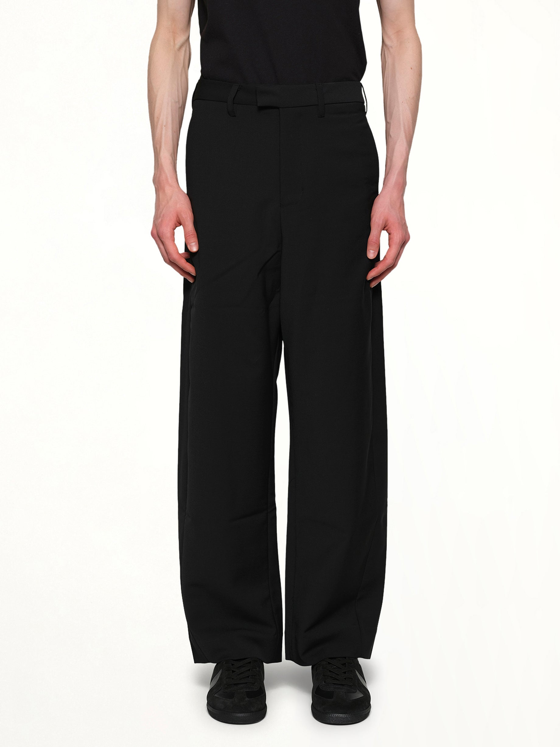 Image of a model wearing Pants. Product name - Lounge Curve Pants in Black colour by brand - ENTIRE STUDIOS