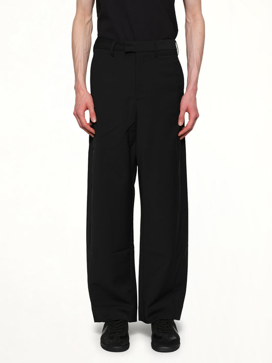 Image of a model wearing Pants. Product name - Lounge Curve Pants in Black colour by brand - ENTIRE STUDIOS