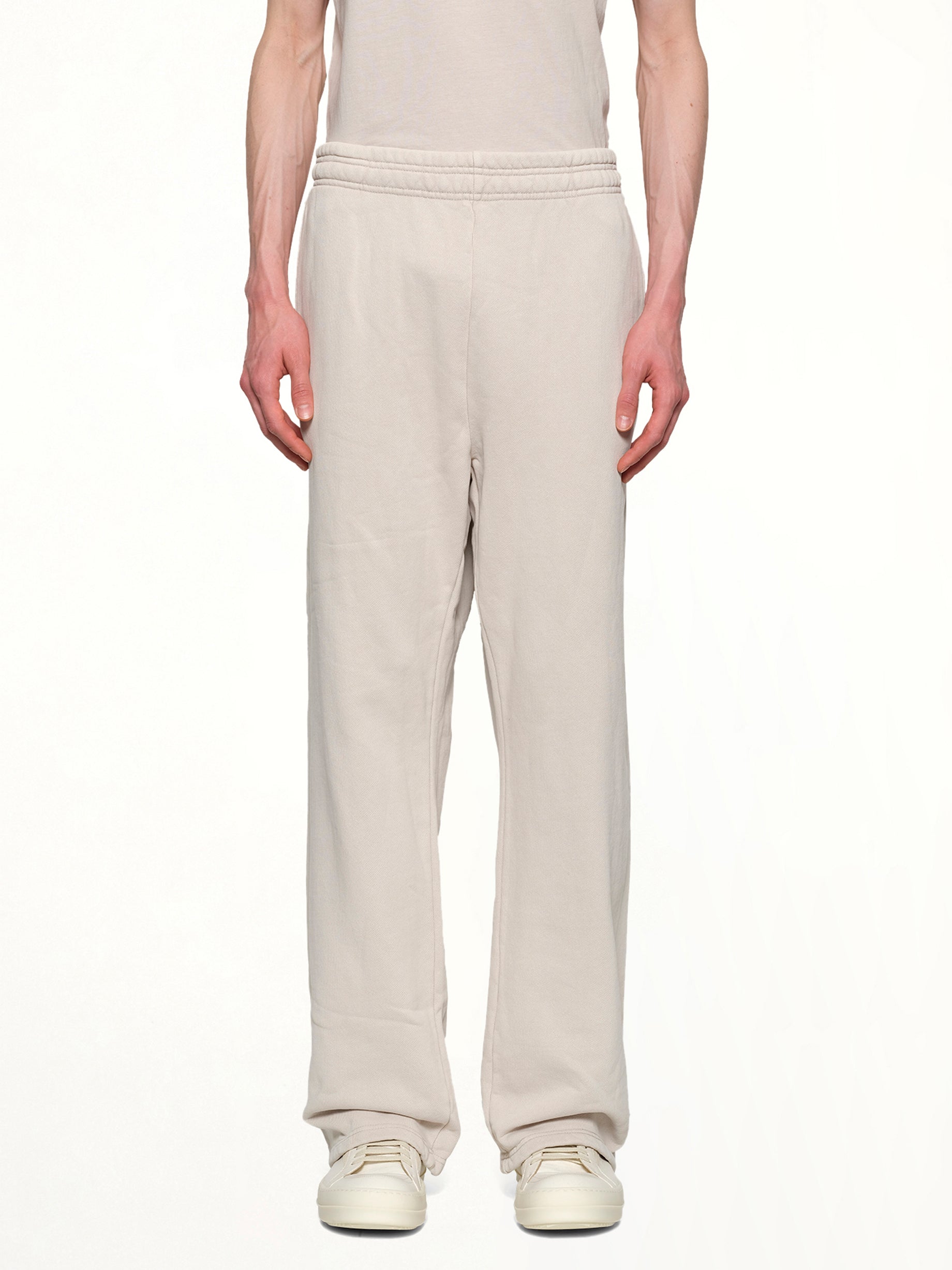 Image of a model wearing Pants. Productname: ENTIRE STUDIOS Straight Leg Sweatpants in OFF WHITE colour by brand - ENTIRE STUDIOS