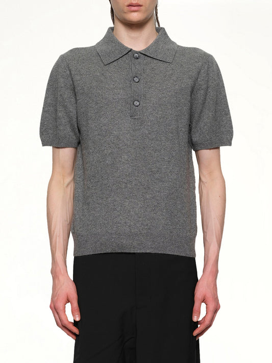 Image of a model wearing Shorts. Productname: ENTIRE STUDIOS Short Sleeve Knit Polo in CONCRETE colour by brand - ENTIRE STUDIOS