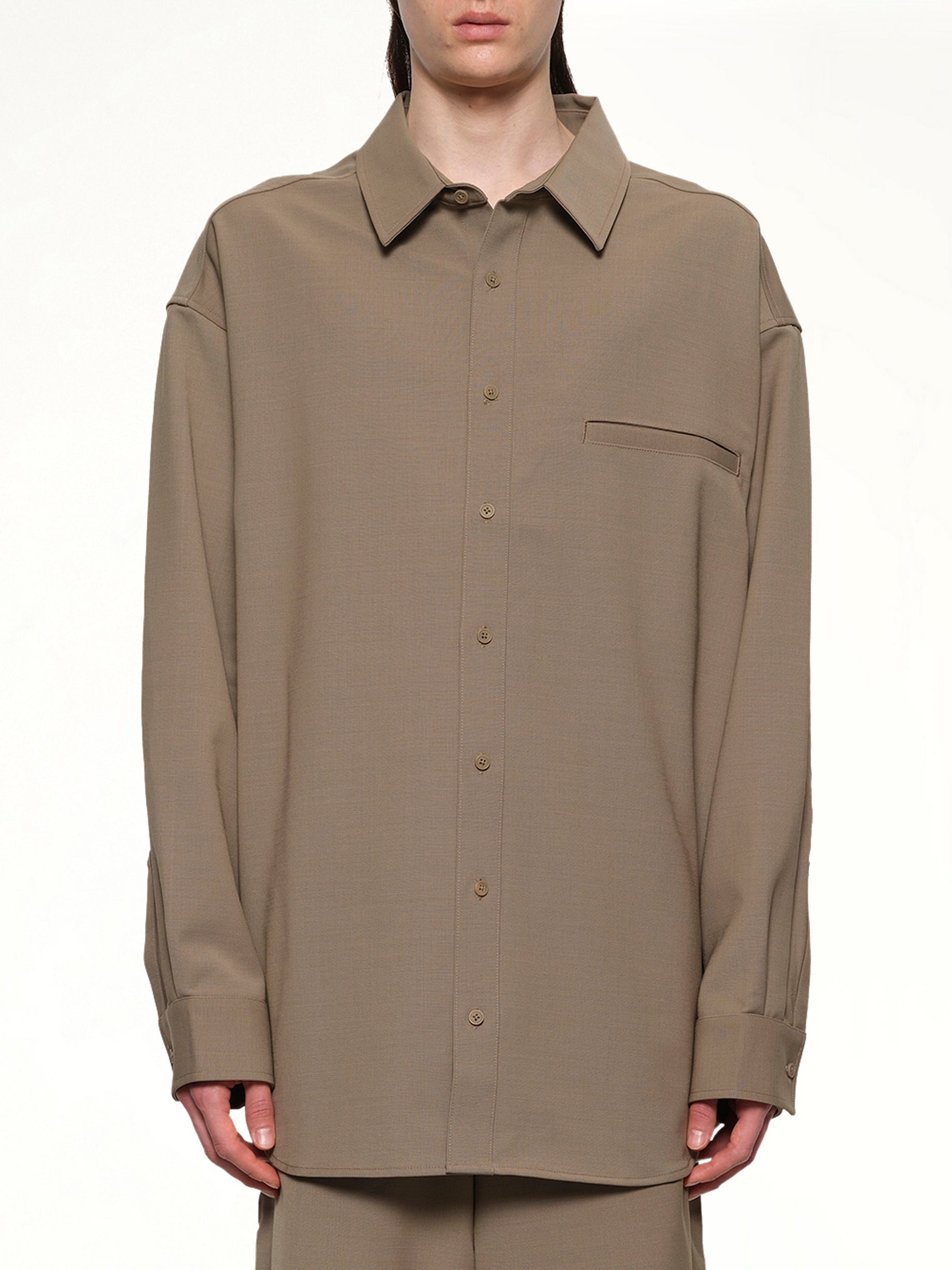 Image of a model wearing Tops. Productname: ENTIRE STUDIOS Giant Shirt in HILLS colour by brand - ENTIRE STUDIOS