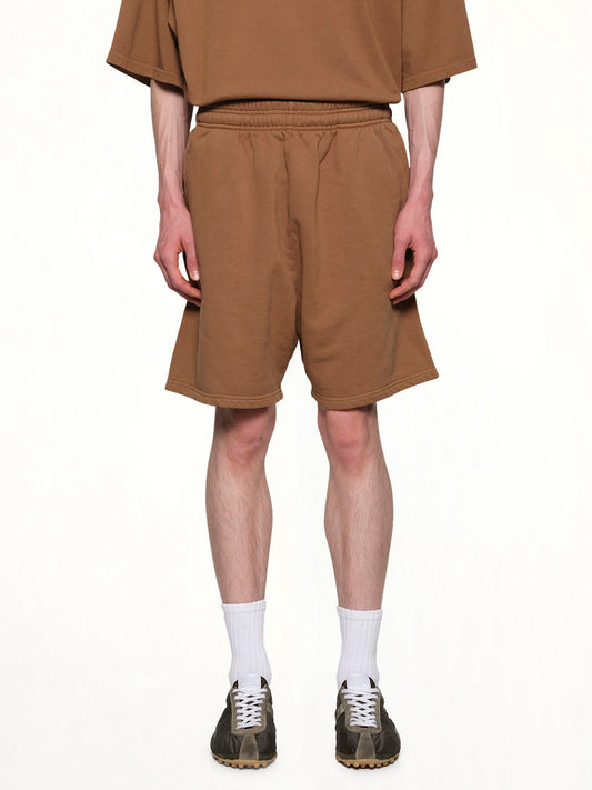 Image of a model wearing Shorts. Productname: ENTIRE STUDIOS Standard Sweatshorts in DUNE colour by brand - ENTIRE STUDIOS