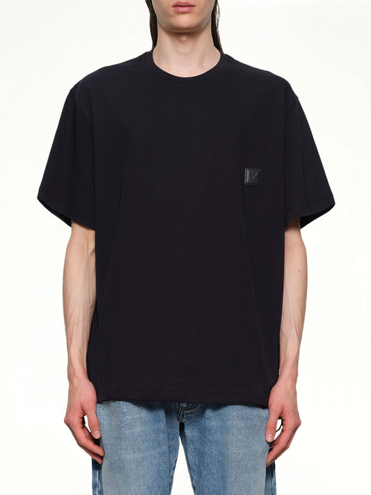 Image of a model wearing Tops. Productname: WOOYOUNGMI Small Logo T-Shirt in NAVY colour by brand - WOOYOUNGMI