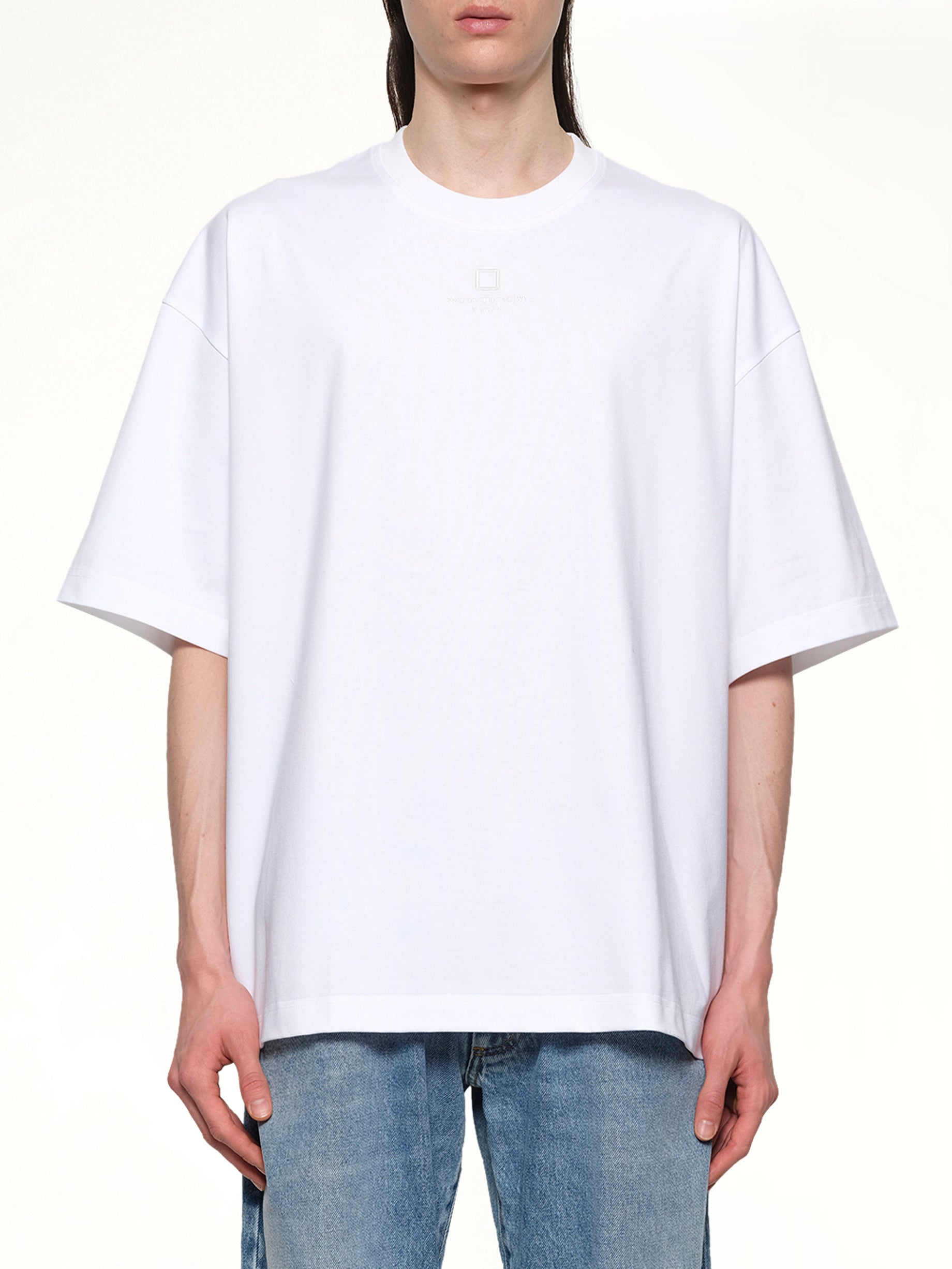 Image of a model wearing Tops. Productname: WOOYOUNGMI Square Embroidery T-Shirt in WHITE colour by brand - WOOYOUNGMI