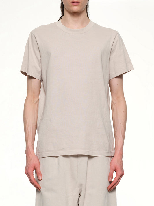 Image of a model wearing Tops. Productname: ENTIRE STUDIOS Standard T-Shirt in OFF WHITE colour by brand - ENTIRE STUDIOS