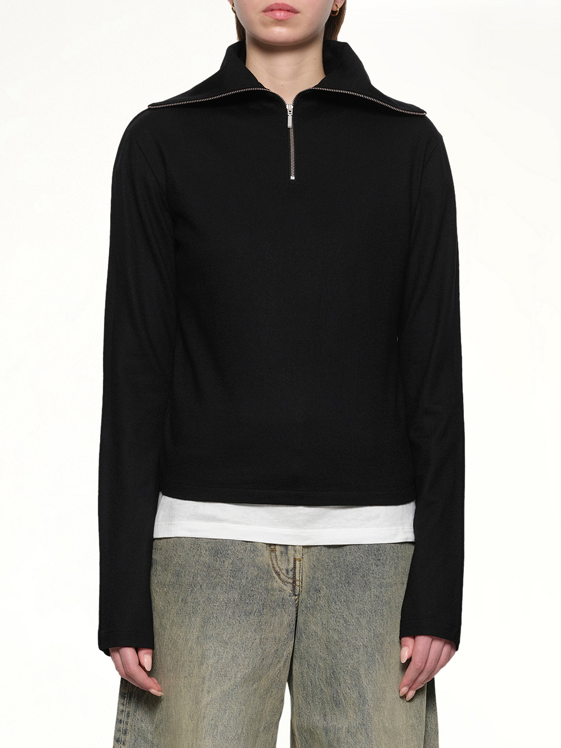 Image of a model wearing Outerwear. Product name - Apex Wool Top in Black colour by brand - ENTIRE STUDIOS