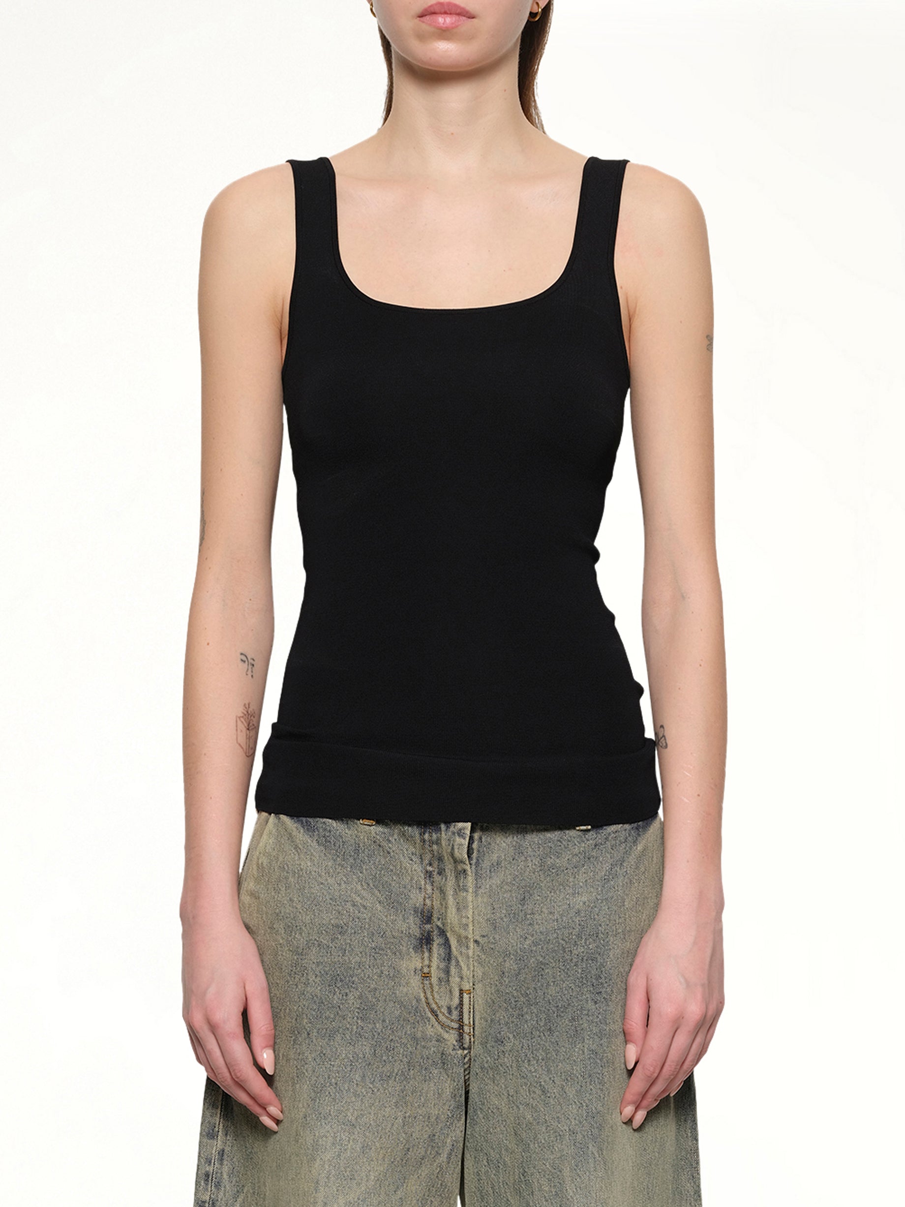 Image of a model wearing Tops. Product name - Squared Neck Top in Black colour by brand - ENTIRE STUDIOS