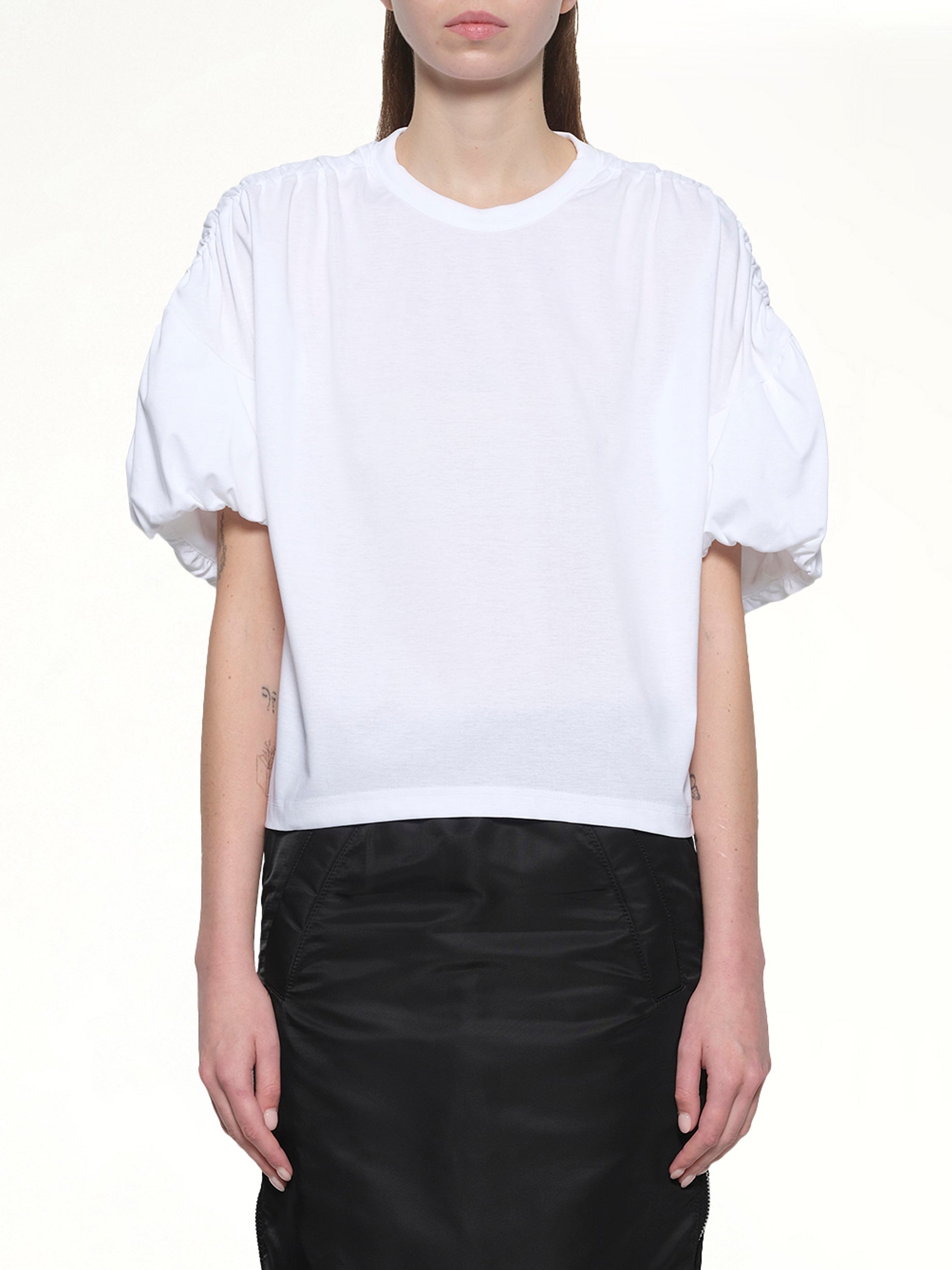 Image of a model wearing Tops. Productname: NOIR KEI NINOMIYA Cotton Ponte T-Shirt in White colour by brand - NOIR KEI NINOMIYA