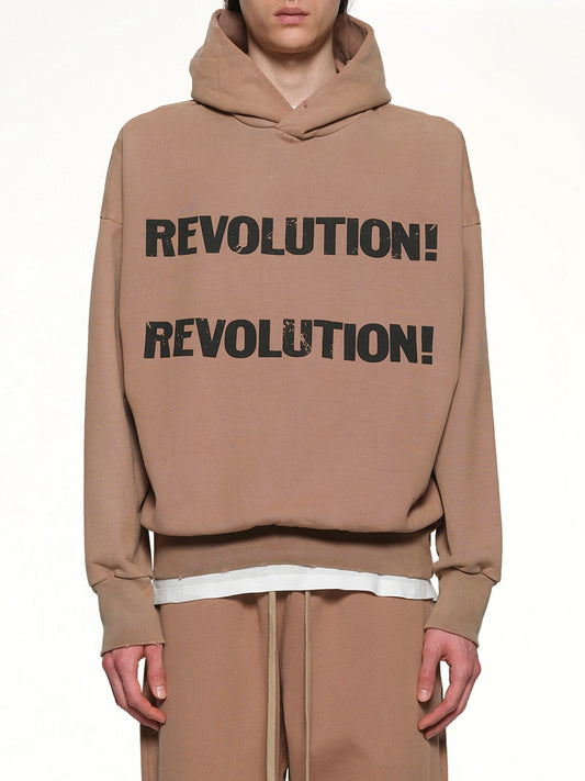 Image of a model wearing Outerwear. Product name - Revolution Hoodie in Dune colour by brand - FEAR OF GOD