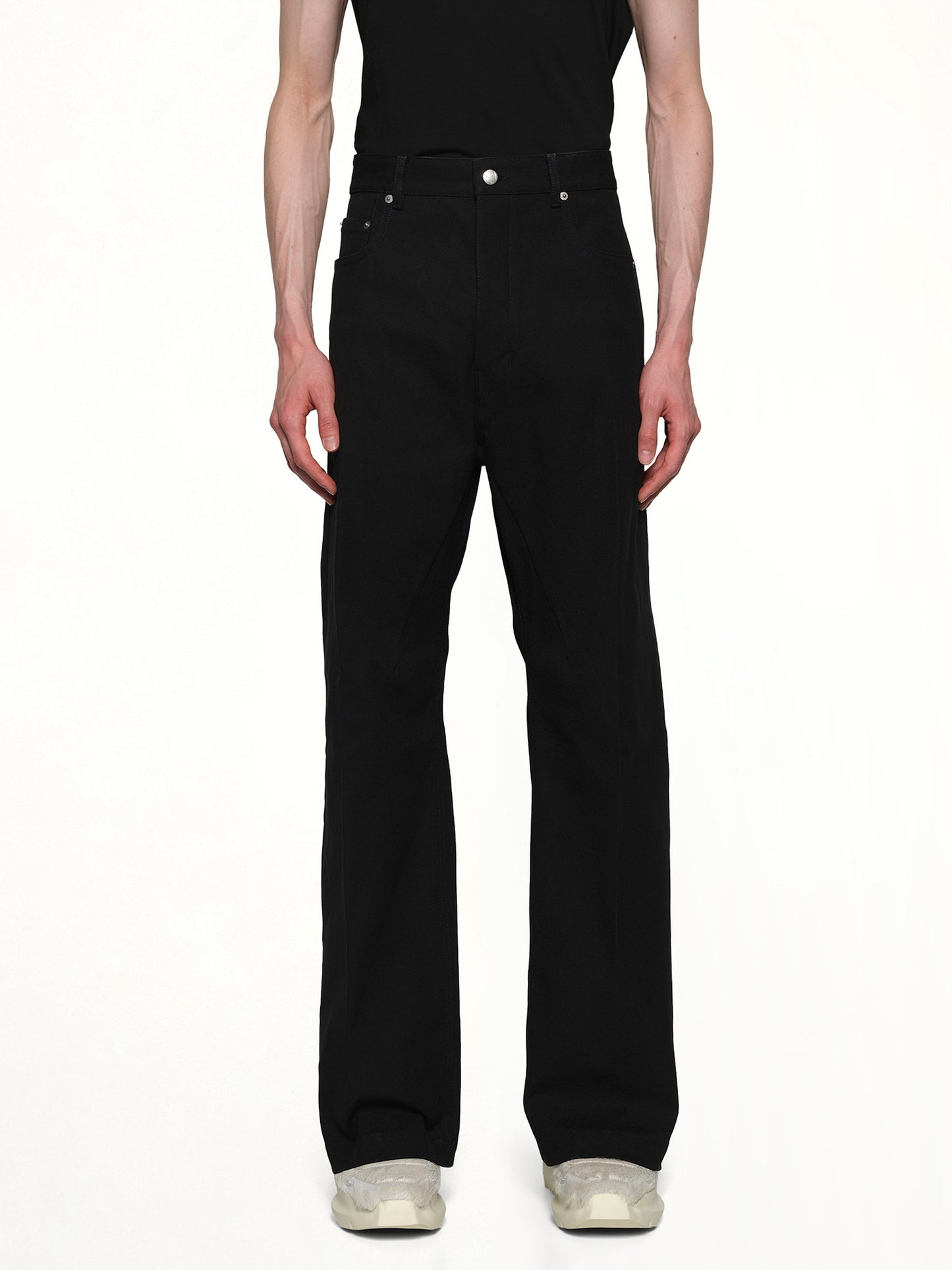 Image of a model wearing Denim. Productname: RICK OWENS Cotton Whipcord Geth Jeans in Black colour by brand - RICK OWENS