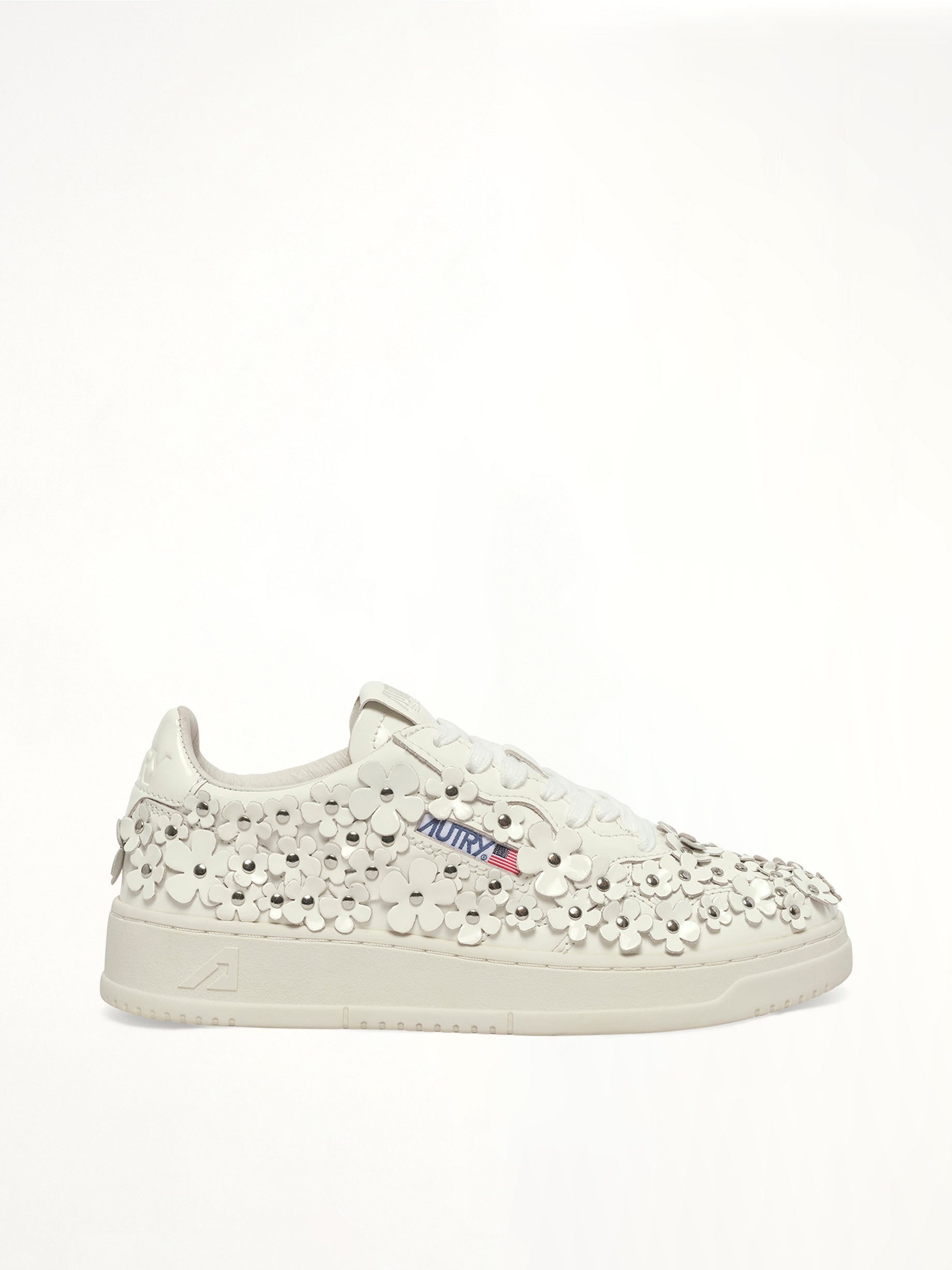 Image of Sneakers. Product name - Medalist Low Patent Flower Sneaker in White colour by brand - AUTRY
