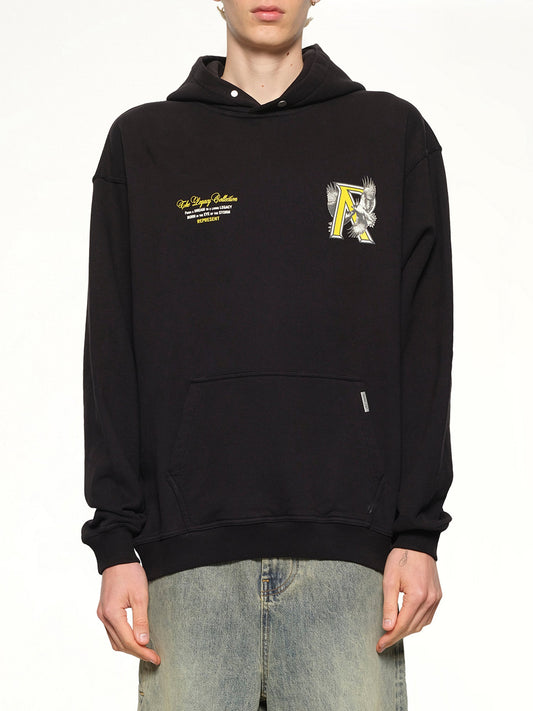Image of a model wearing Outerwear. Productname: REPRESENT Legacy Falcon Hoodie in Jet Black colour by brand - REPRESENT