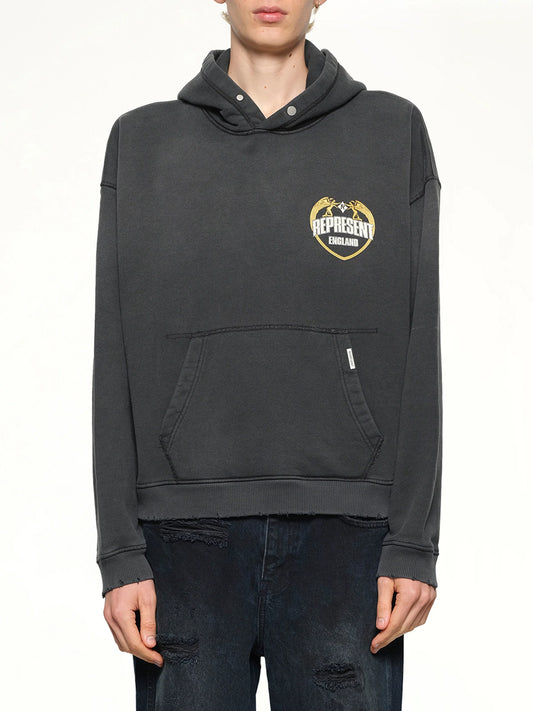 Image of a model wearing Outerwear. Product name - Represent Angel Border Hoodie in Stained Black colour by brand - REPRESENT