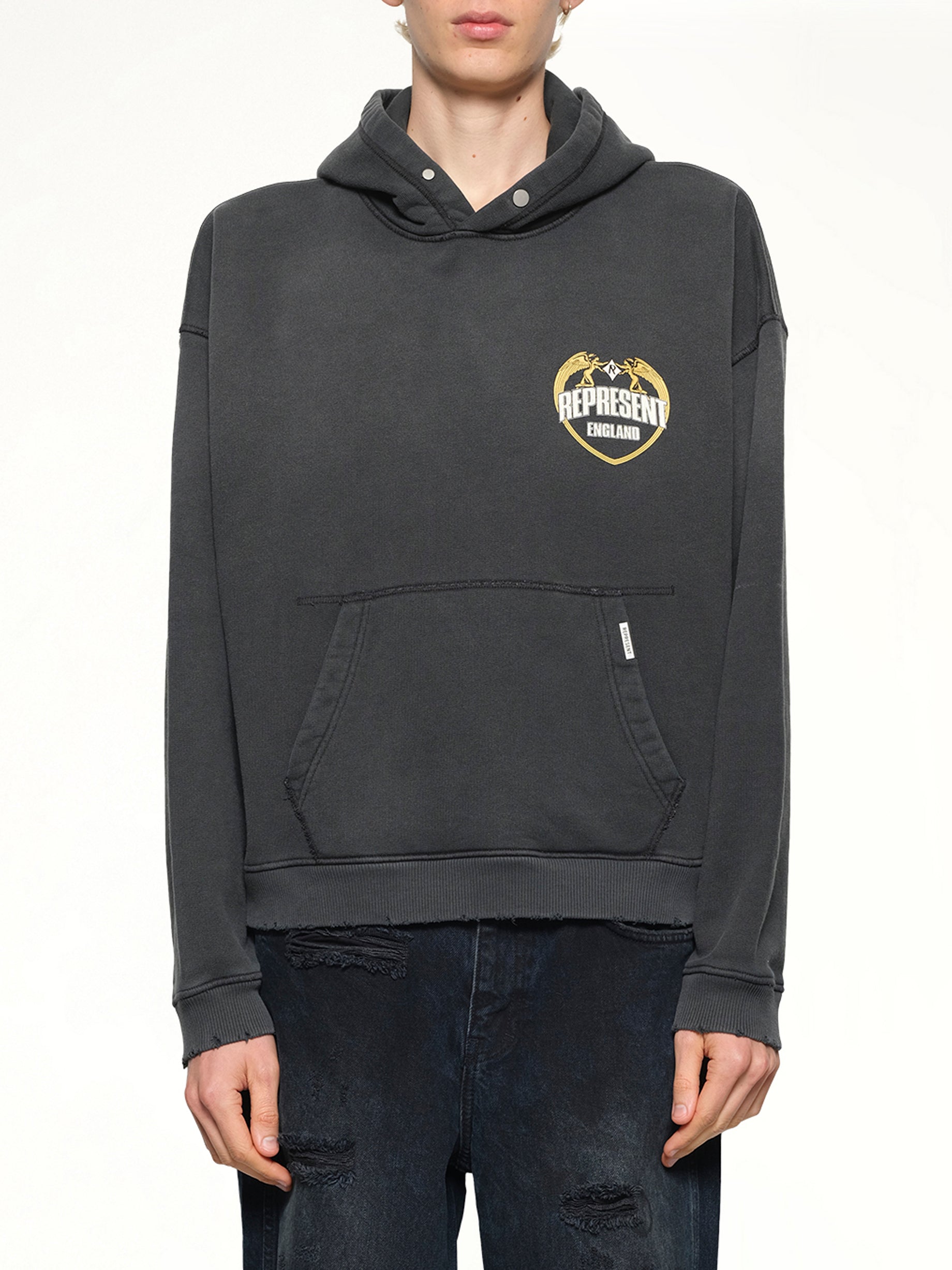 Image of a model wearing Outerwear. Product name - Represent Angel Border Hoodie in Stained Black colour by brand - REPRESENT