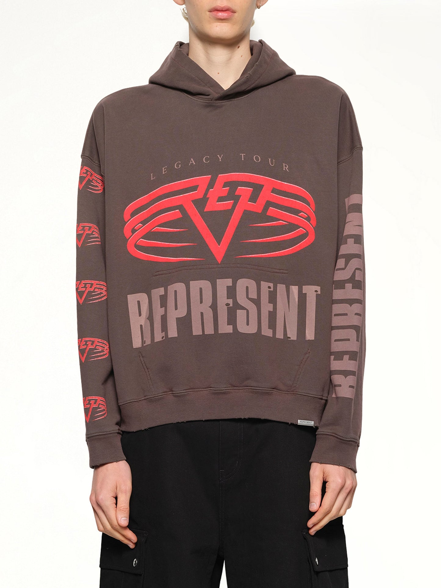 Image of a model wearing Outerwear. Productname: REPRESENT Reversible Living Legacy Falcon Hoodie in Nero colour by brand - REPRESENT