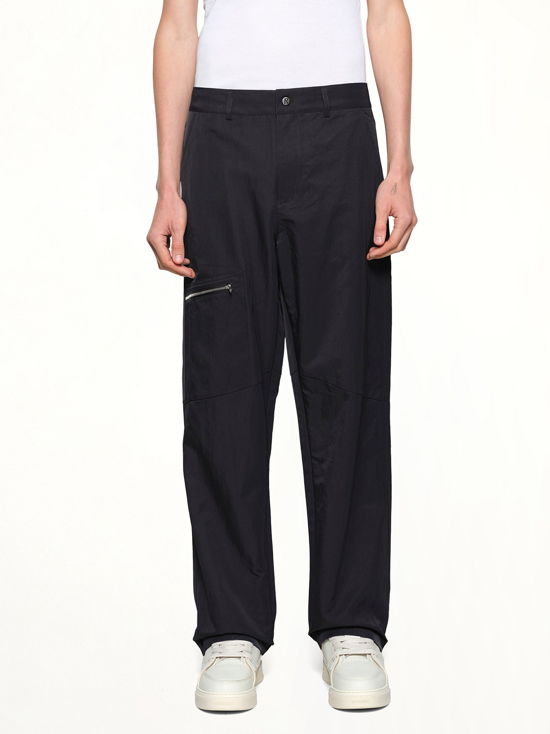 Image of a model wearing Uniforms & Workwear. Productname: REPRESENT Nylon Workwear Pant in Jet Black colour by brand - REPRESENT