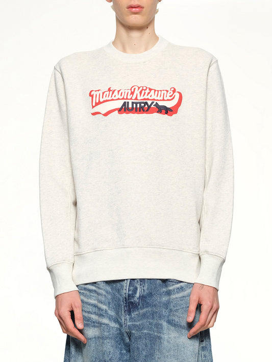 Image of a model wearing Outerwear. Product name - Autry x Maison Kitsune Sweatshirt in Grey Melange colour by brand - AUTRY