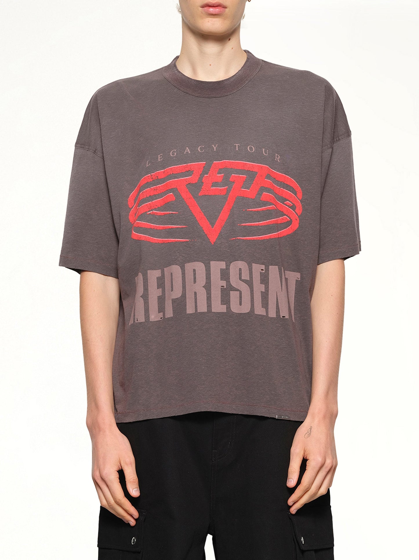 Image of a model wearing Tops. Productname: REPRESENT Reversible Living Legacy Falcon T-Shirt in Nero colour by brand - REPRESENT