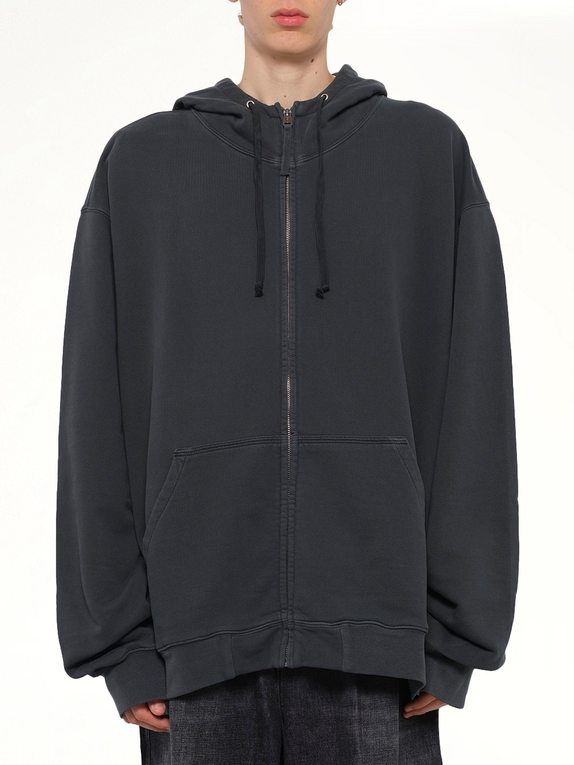 Image of a model wearing Outerwear. Product name - Lightweight Firm Zip Hoodie in Charcoal colour by brand - MAISON MARGIELA