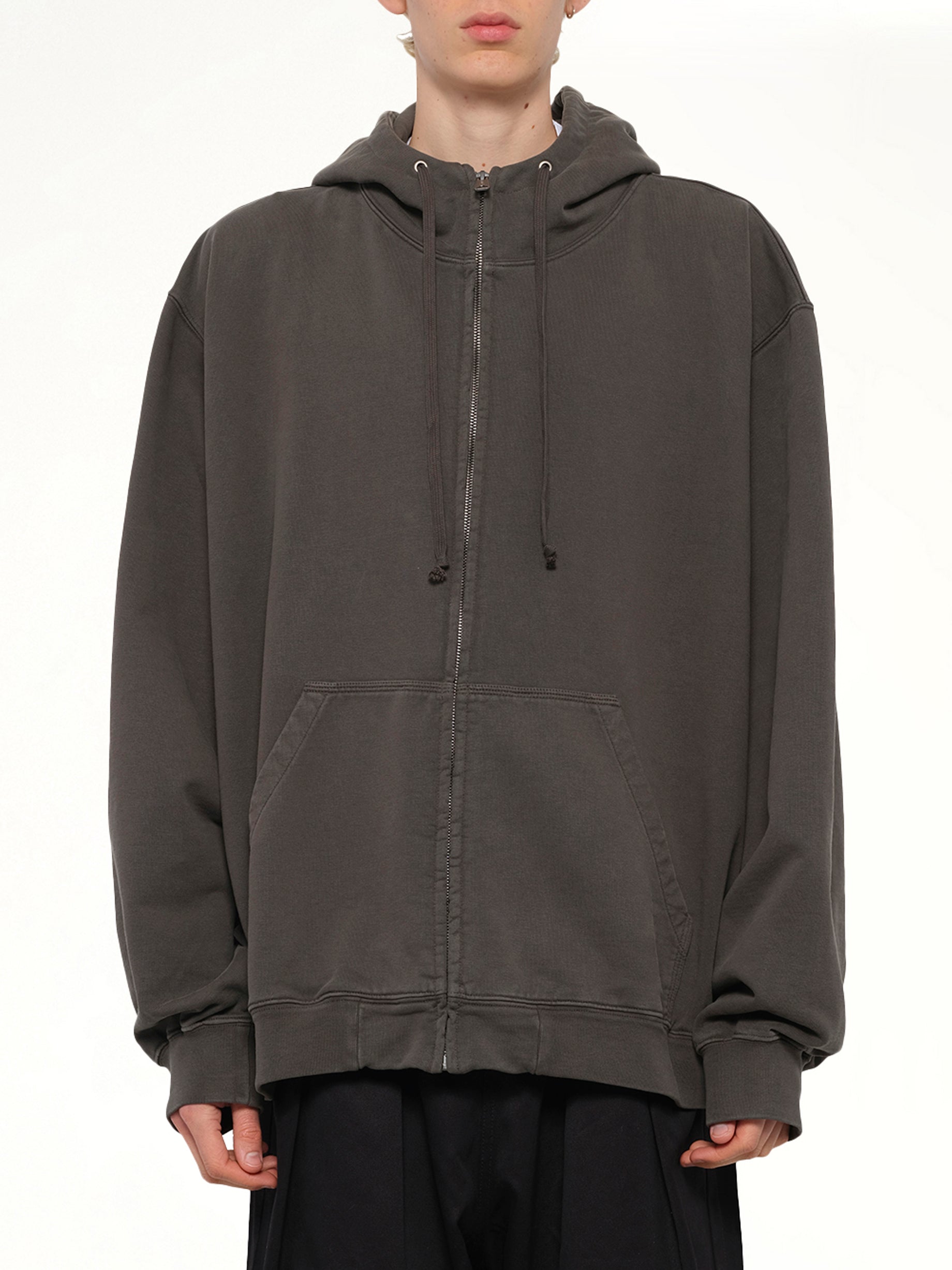 Image of a model wearing Outerwear. Product name - Zip Hoodie in Grey colour by brand - MAISON MARGIELA