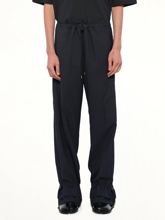 Image of a model wearing Pants. Product name - Wool Pants in Dark Blu colour by brand - MAISON MARGIELA