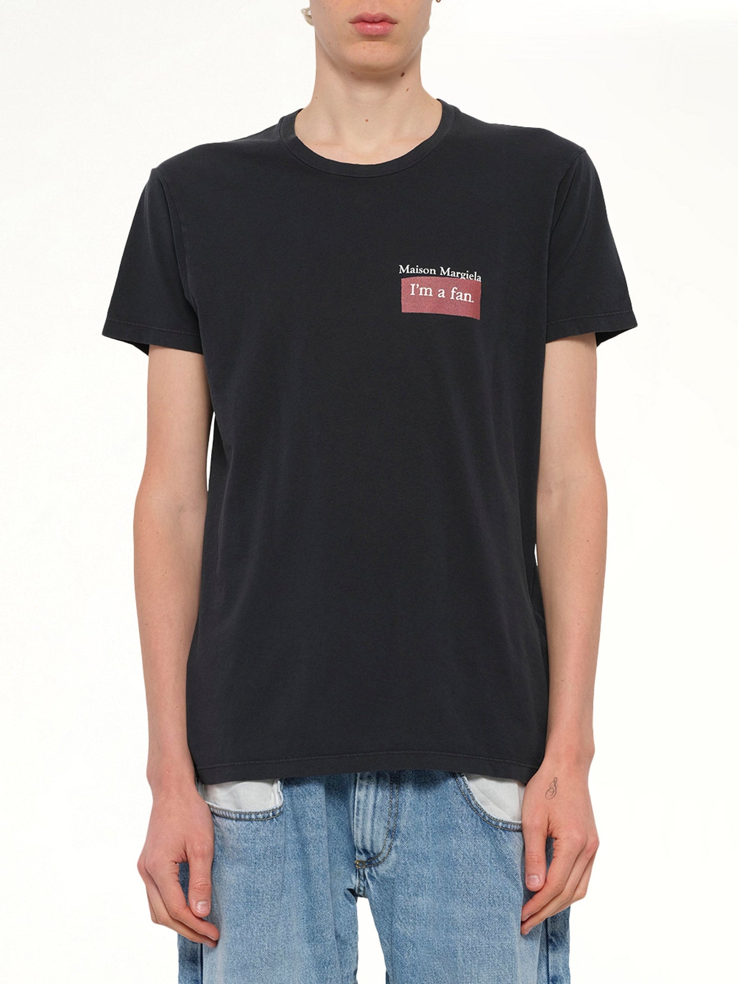 Image of a model wearing Tops. Productname: MAISON MARGIELA "I'm a Fan" T-Shirt in Charcoal colour by brand - MAISON MARGIELA