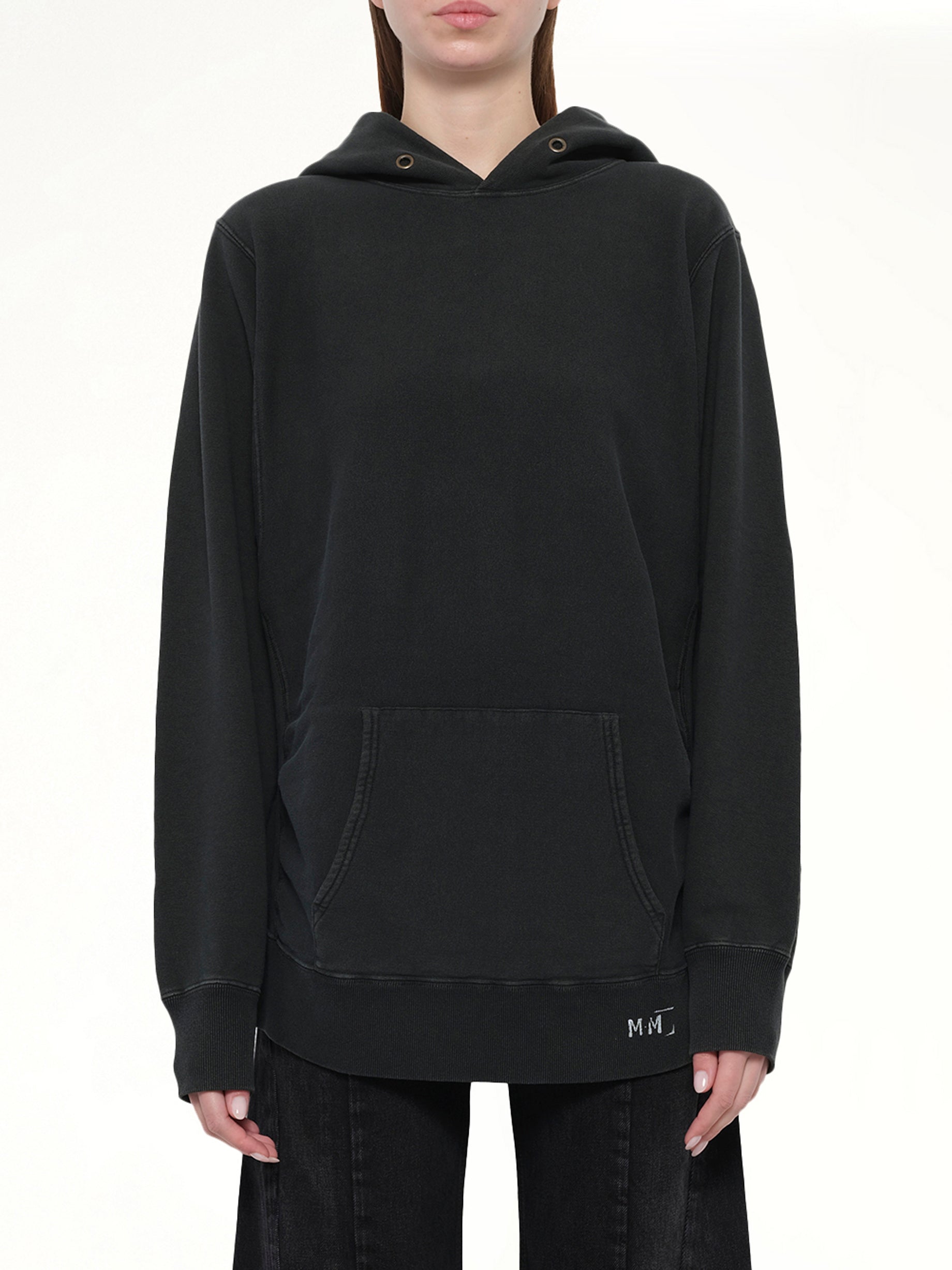 Image of a model wearing Outerwear. Productname: MAISON MARGIELA Organic Cotton Fleece Hoodie in Vintage Carbon colour by brand - MAISON MARGIELA