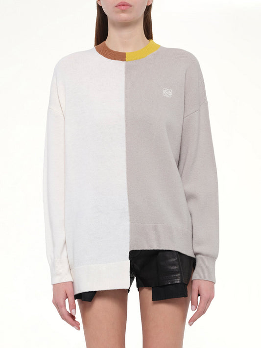 Image of a model wearing Outerwear. Product name - Asymmetric Sweater in Mustard/Bronze colour by brand - LOEWE