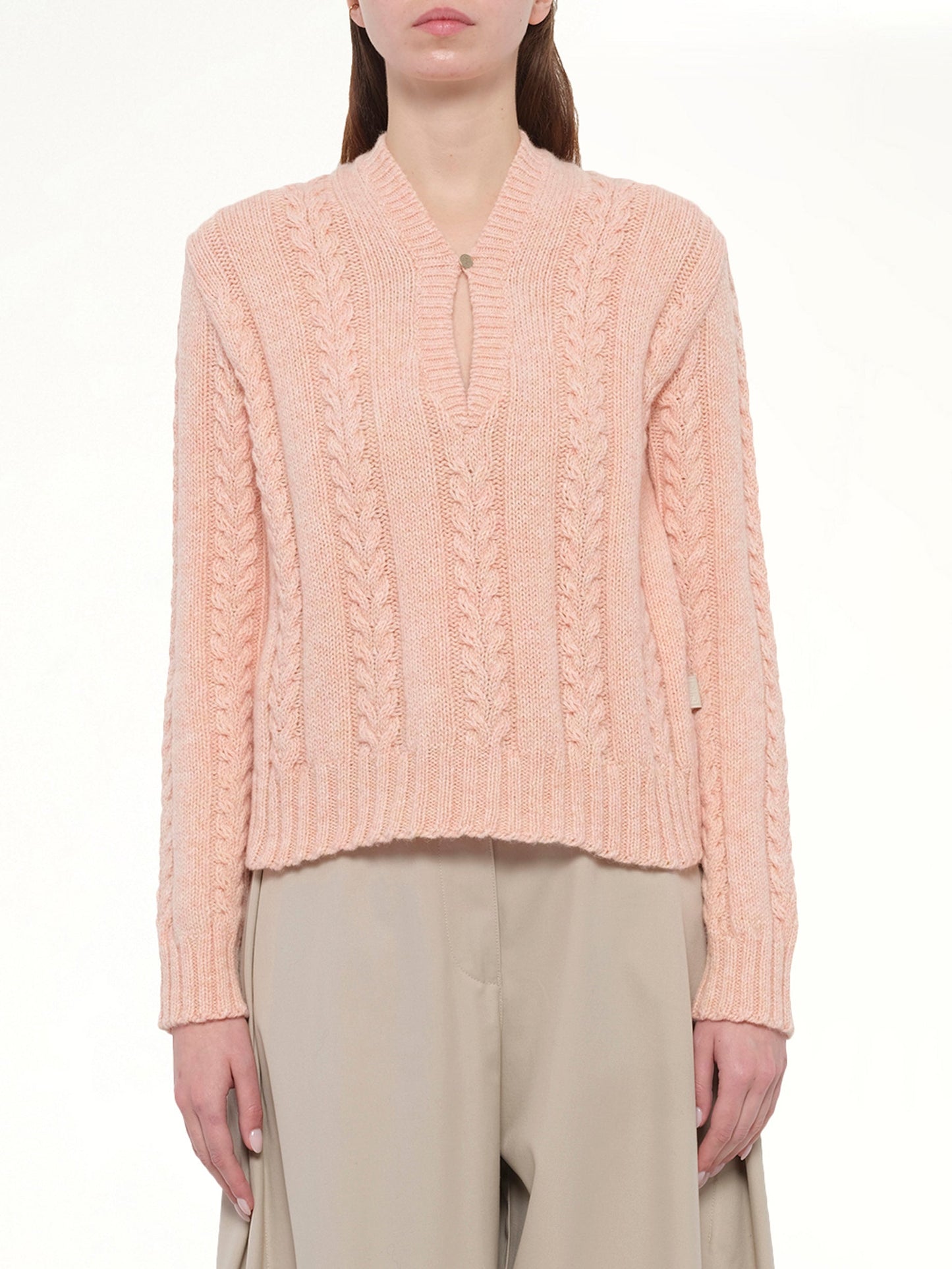 Image of a model wearing Outerwear. Product name - Sweater in Pink colour by brand - LOEWE